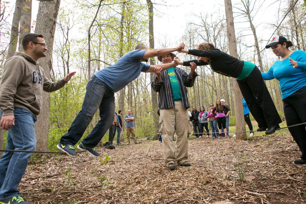 Adults Doing Activities At A Group Retreat