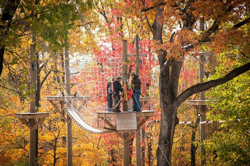 A Family Getting Ready To Zipline At Refreshing Mountain Outdoor Adventure And Retreat Center During The Fall